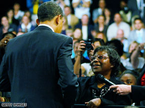 President Obama talks to Henrietta Hughes at a town hall rally in Fort Myers, Florida, on Tuesday.