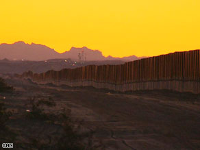 Border agent Mike Lowrie patrols the area. He says the barrier has helped cut illegal entries into the U.S.