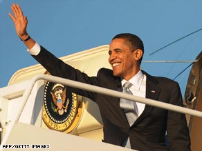 President Obama waves as he boards Air Force One for Chicago, where the Obamas were to spend the weekend.
