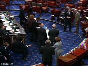 Sen. Sherrod Brown speaks to Senate Majority Leader Harry Reid at right on the Senate floor Friday.