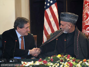Afghanistan President Hamid Karzai, right, meets with Richard Holbrooke in Kabul on February 15, 2009.