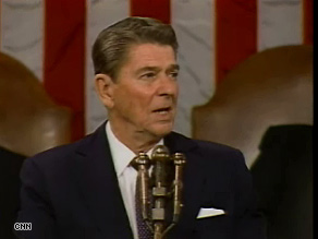 Franklin Roosevelt sits at a table as he addresses Congress in 1945.