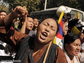 In India on Wednesday, Tibetans living in exile protest Chinese rule in Tibet.