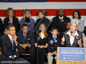 Then-presidential candidate Barack Obama listens to Gov. Kathleen Sebelius during a January 2008 rally.