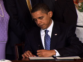 President Obama signs the executive order on stem cell policy Monday at the White House.