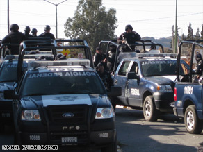 A police convoy moves in Ciudad Juarez, Mexico, last month, across the U.S. border from El Paso, Texas.