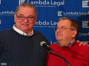 Larry Hoch, left, and David Twombley, one of six couples that filed suit, celebrate Friday at a news conference.