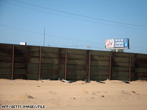 A fence separates the United States from Mexico in the U.S. Border Patrol's Yuma Sector in San Luis, Arizona.