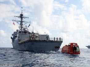 The USS Bainbridge tows a lifeboat in which the captain of the Maersk Alabama was held hostage.