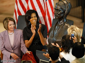 Speaker Nancy Pelosi and first lady Michelle Obama applaud the unveiling of the Sojourner Truth bust.