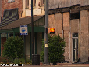 Storefront after storefront are closed and buildings are boarded up and falling into disrepair in Selma.