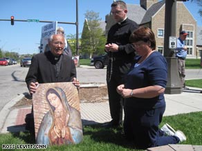 People pray at the University of Notre Dame to protest Obama's commencement address.