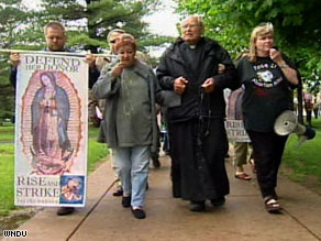 Protesters don't think President Obama's views are in line with Notre Dame University.
