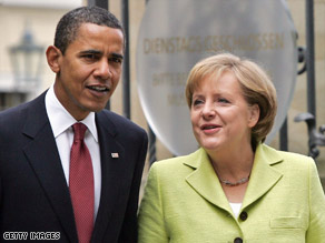 President Obama talks with German Chancellor Angela Merkel in Dresden, Germany, on Friday.