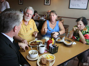 CNN's John King, from left, talks health care with diners Stafford Ezzard and Margaret and Blanche Dormady.