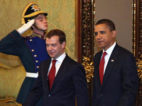 President Obama, right, and Russian President Dmitry Medvedev walk by an honor guard in Moscow on Monday.