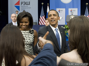 U.S. President Barack Obama and First  Lady Michelle Obama greet graduates at the New Economic School.