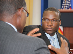 Kevin Lewis, center, enjoys a conversation with President Obama.