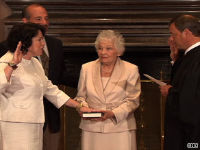 Judge Sonia Sotomayor takes the judicial oath Saturday as her mother, Celina, holds the Bible.