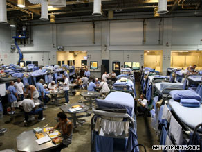 Inmates at Mule Creek State Prison in Ione, California, interact in a gym modified to house them in August 2007.