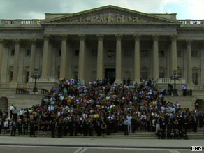 A large garthering awaits the hearse carrying the body of Sen. Kennedy on Saturday outside the U.S. Capitol.