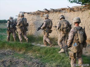 U.S. Marines, with Afghan soldiers and police, board a helicopter at Forward Operating Base Dwyer, Afghanistan.