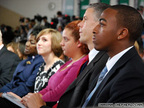 Education Secretary Arne Duncan, second from right, listens to Obama's speech Tuesday.