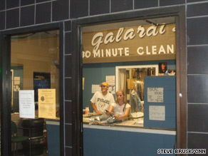 Another business in Pittsburgh sports "Welcome" banners on plywood covering the windows.