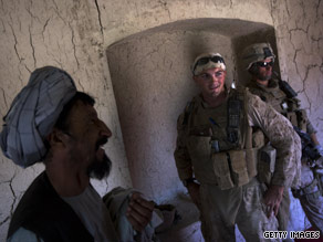 Marines speak to Afghan villagers in southern Afghanistan, on September 28.