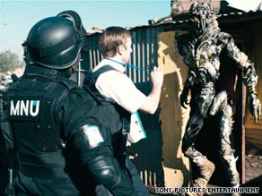 A company operative (Sharlto Copley) gets an alien's attention in "District 9."