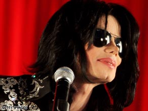 A Michael Jackson impersonator is interviewed outside the London hotel where the singer is staying.