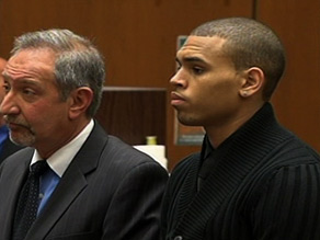 Singer Chris Brown, right, appeared in court Monday on charges of assaulting singer Rihanna.