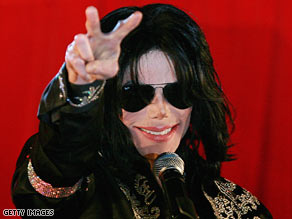 Michael Jackson gestures to the crowd at the March announcement for his series of London concerts.