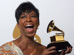 Natalie Cole holds one of the Grammys she received in February for "Still Unforgettable."