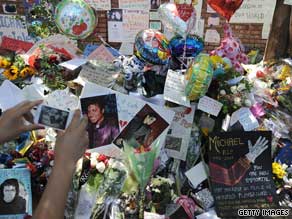 Fans have set up impromptu shrines to Michael Jackson, including this one at his family's house.