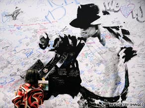 A memorial poster for Michael Jackson is displayed outside Staples Center in Los Angeles on Sunday.