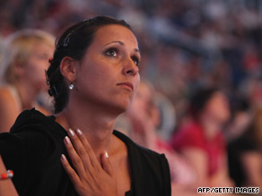 A Michael Jackson fan in Berlin watches footage of the memorial concert.