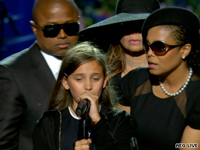 Jermaine Jackson sings his brother's favorite song "Smile" in front of the King of Pop's casket.