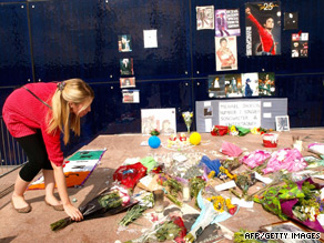 Fans started laying tributes to Michael Jackson at a temporary shrine at the O2 Arena the day after his death.