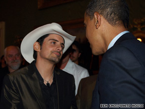 Paisley shakes hands and talks with President Obama after his performance.