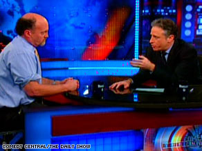 Jim Cramer, left, appears on "The Daily Show" Thursday with host Jon Stewart.