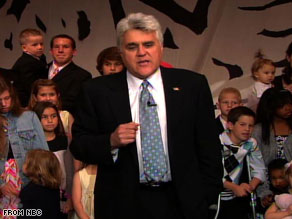 Jay Leno stands with the children of people who met and started families while working on the show.