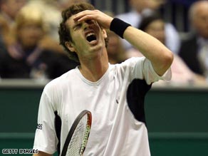 Murray agonizes over a missed point on his way into the second round of the Rotterdam Open.