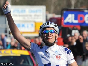 Roy raises his arm in triumph after securing his first win as a professional.