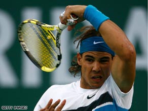 Nadal hooks a trademark forehand during his routine win over Berrer.