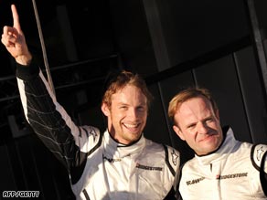 Button (left) and Barrichello started the season with a 1-2 for Brawn GP.