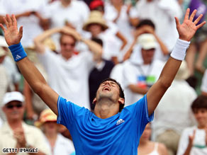 Novak Djokovic reacts Friday after defeating Roger Federer in Key Biscayne, Florida.