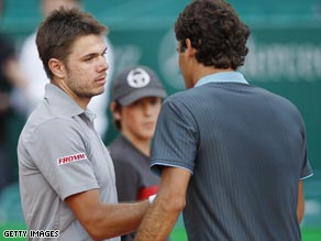 Federer (right) congratulates Wawrinka after his fellow-Swiss dumped him out of the Monte Carlo Masters.