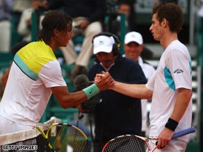 Nadal (left) shakes hands with Murray at the conclusion of their semifinal.