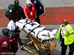 Ethiopia's 2008 winner Dire Tune is stretchered away after losing her Boston Marathon title on the line.